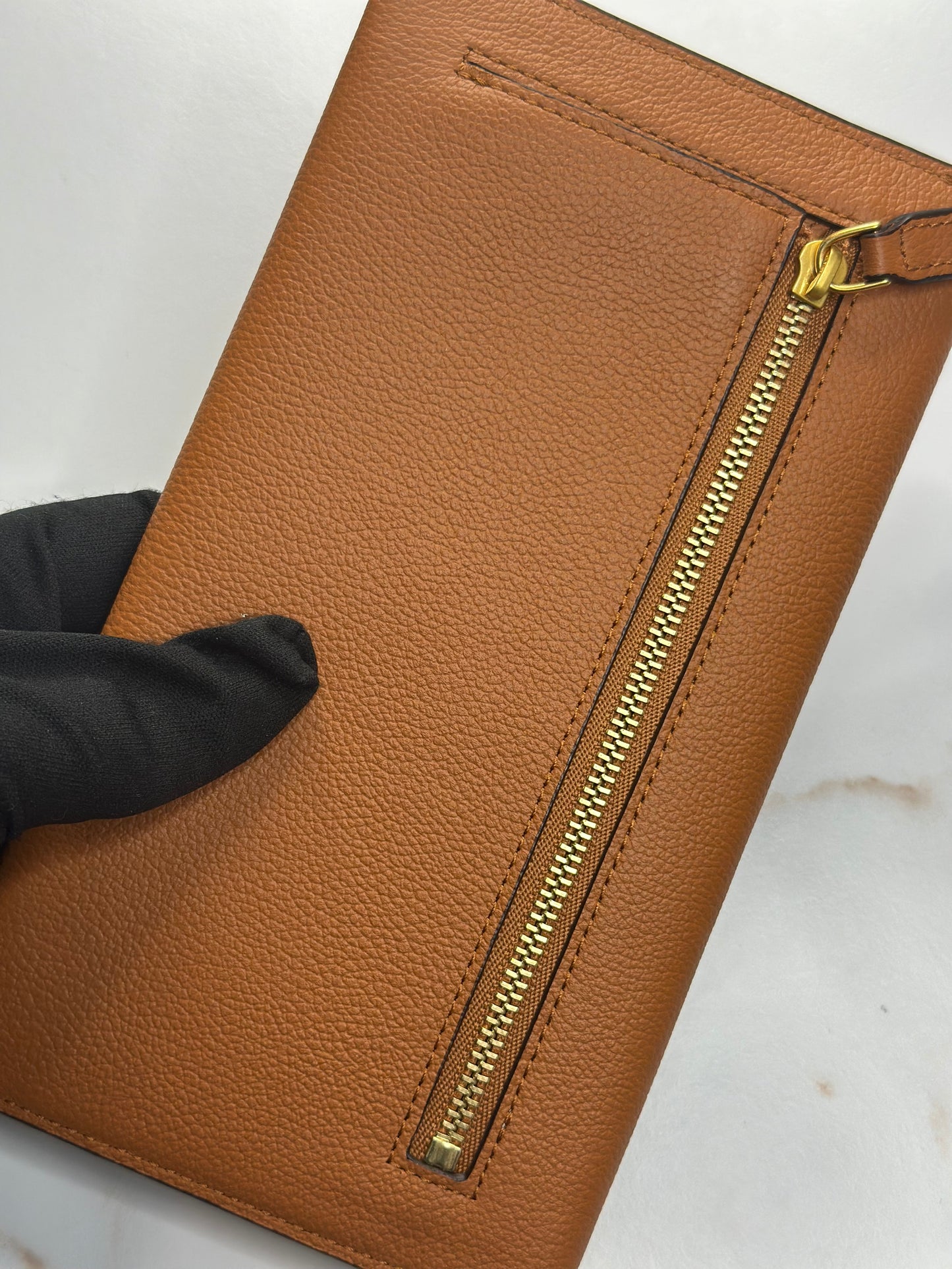 Pre-Owned MCM Himmel Continental Pouch in embossed cognac leather