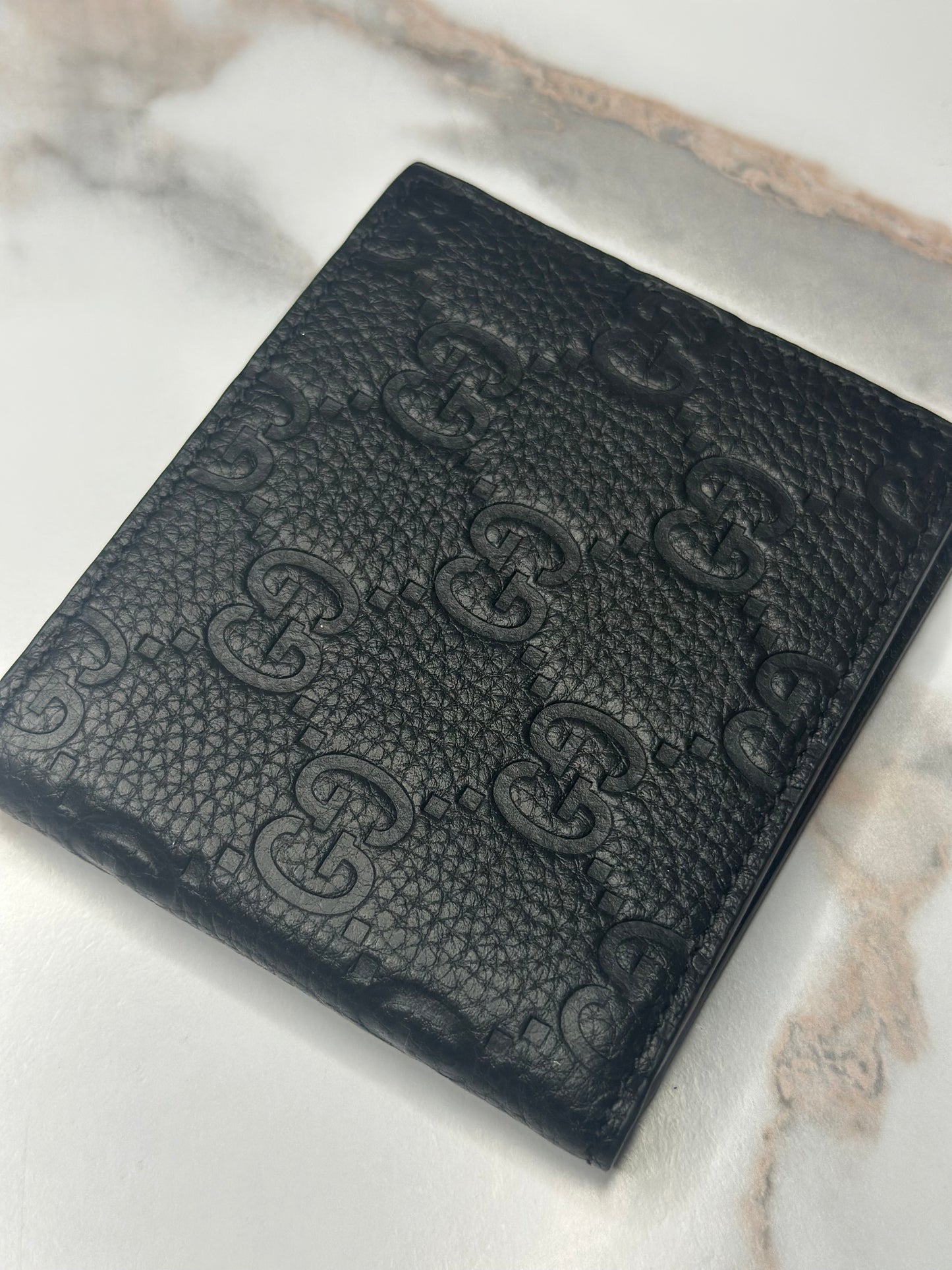 Pre-owned Gucci GG Embossed leather mens bi-fold wallet