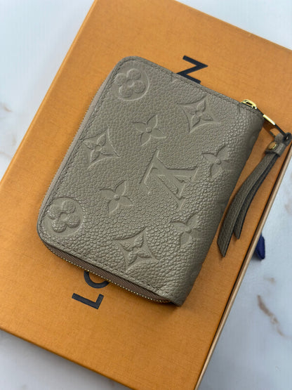 Pre-owned Louis Vuitton monogram Empriente leather compact zippy