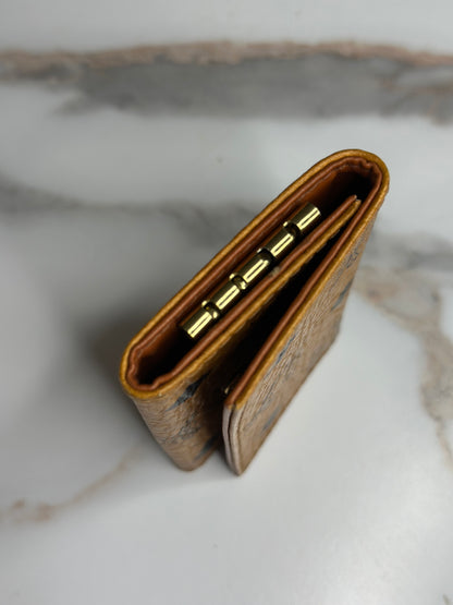 Pre-owned MCM key holder in cognac Visetos monogram canvas with brown leather interior