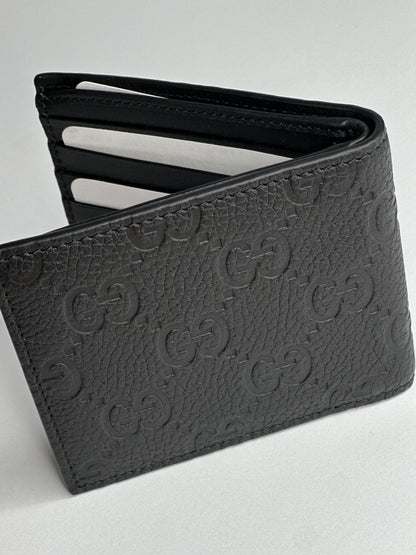 Pre-owned Gucci GG embossed black leather bifold wallet