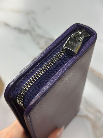 Pre-owned Loewe Anagram continental zip wallet in pebble-grained lilac purple leather