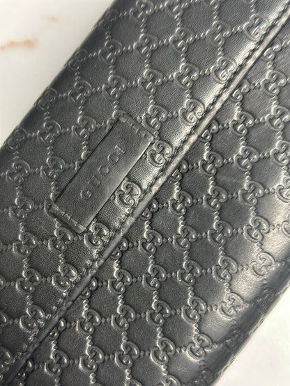 Pre-owned Gucci black Microguccisima embossed zippy wallet