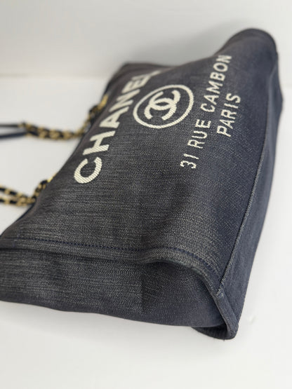 Pre-owned Chanel Deauville tote bag crafted in blue denim with gold-tone hardware medium tote