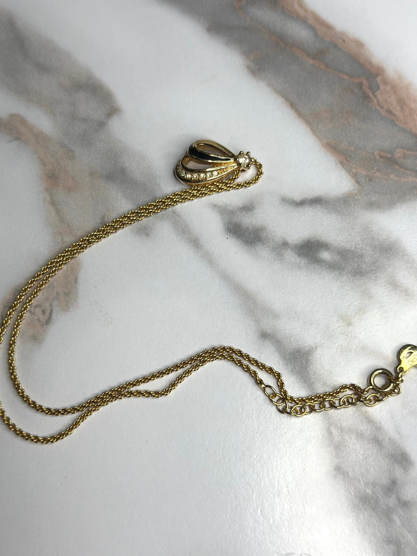 Pre-owned Christian Dior vintage necklace features a gold-tone teardrop pendant set with black enamel and crystals