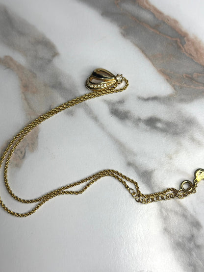 Pre-owned Christian Dior vintage necklace features a gold-tone teardrop pendant set with black enamel and crystals