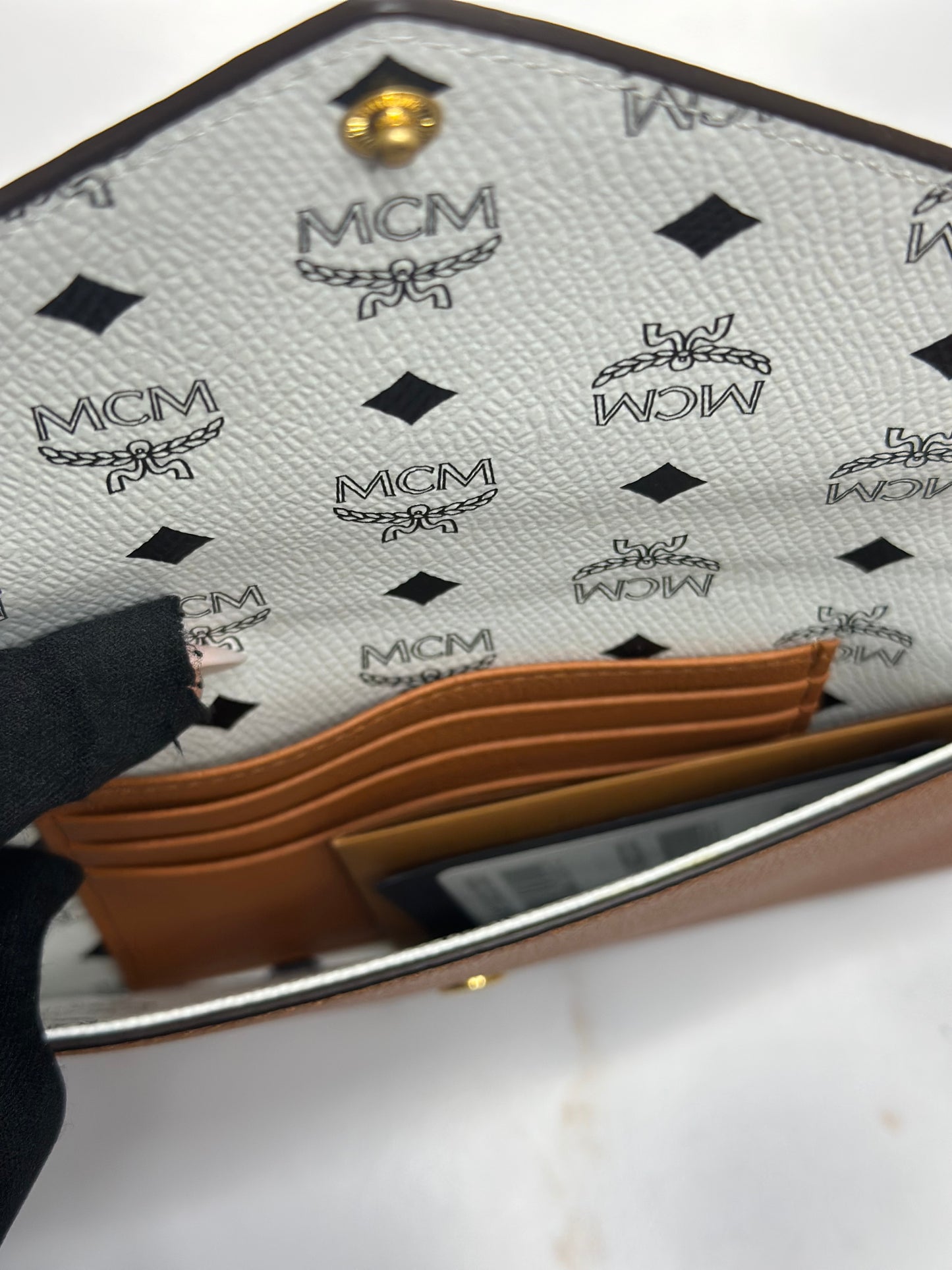 Pre-Owned MCM Himmel Continental Pouch in embossed cognac leather