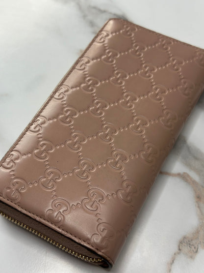 Pre-owned Gucci Guccissima continental zip-around wallet with a bow detail in a rose beige leather