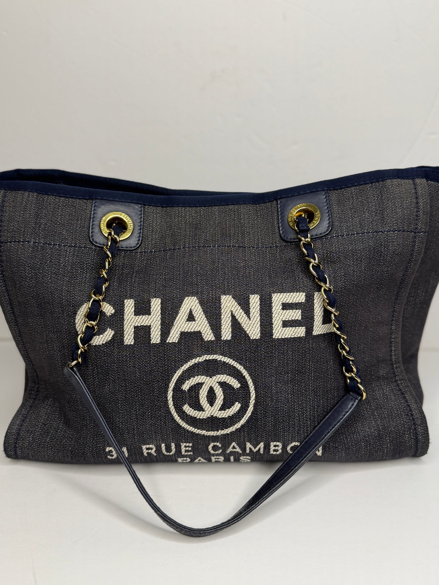 Pre-owned Chanel Deauville tote bag crafted in blue denim with gold-tone hardware medium tote