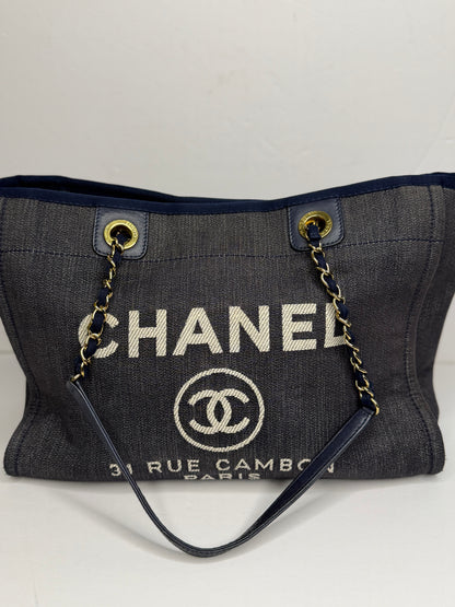 Pre-owned Chanel Deauville tote bag crafted in blue denim with gold-tone hardware medium tote