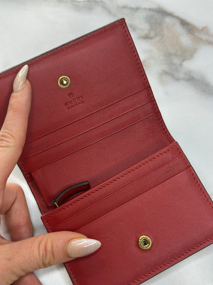 Pre-owned Gucci GG Supreme canvas bifold or compact wallet with a cherry embellishment.