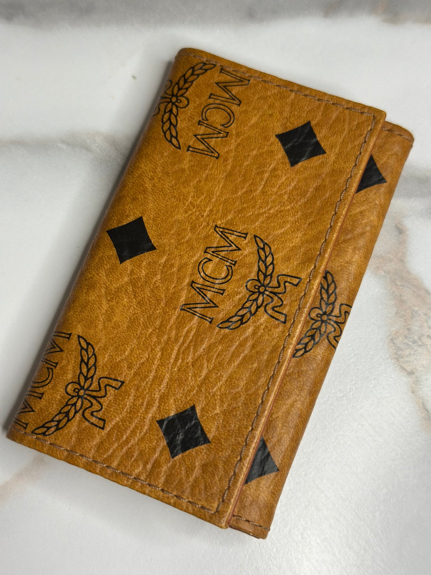 Pre-owned MCM key holder in cognac Visetos monogram canvas with brown leather interior