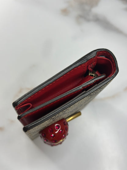Pre-owned Gucci GG Supreme canvas bifold or compact wallet with a cherry embellishment.