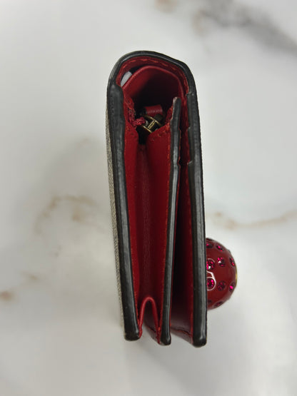 Pre-owned Gucci GG Supreme canvas bifold or compact wallet with a cherry embellishment.
