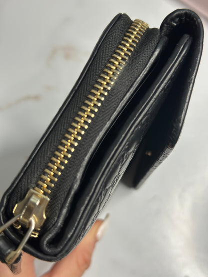 Pre-owned Gucci black Microguccisima embossed zippy wallet