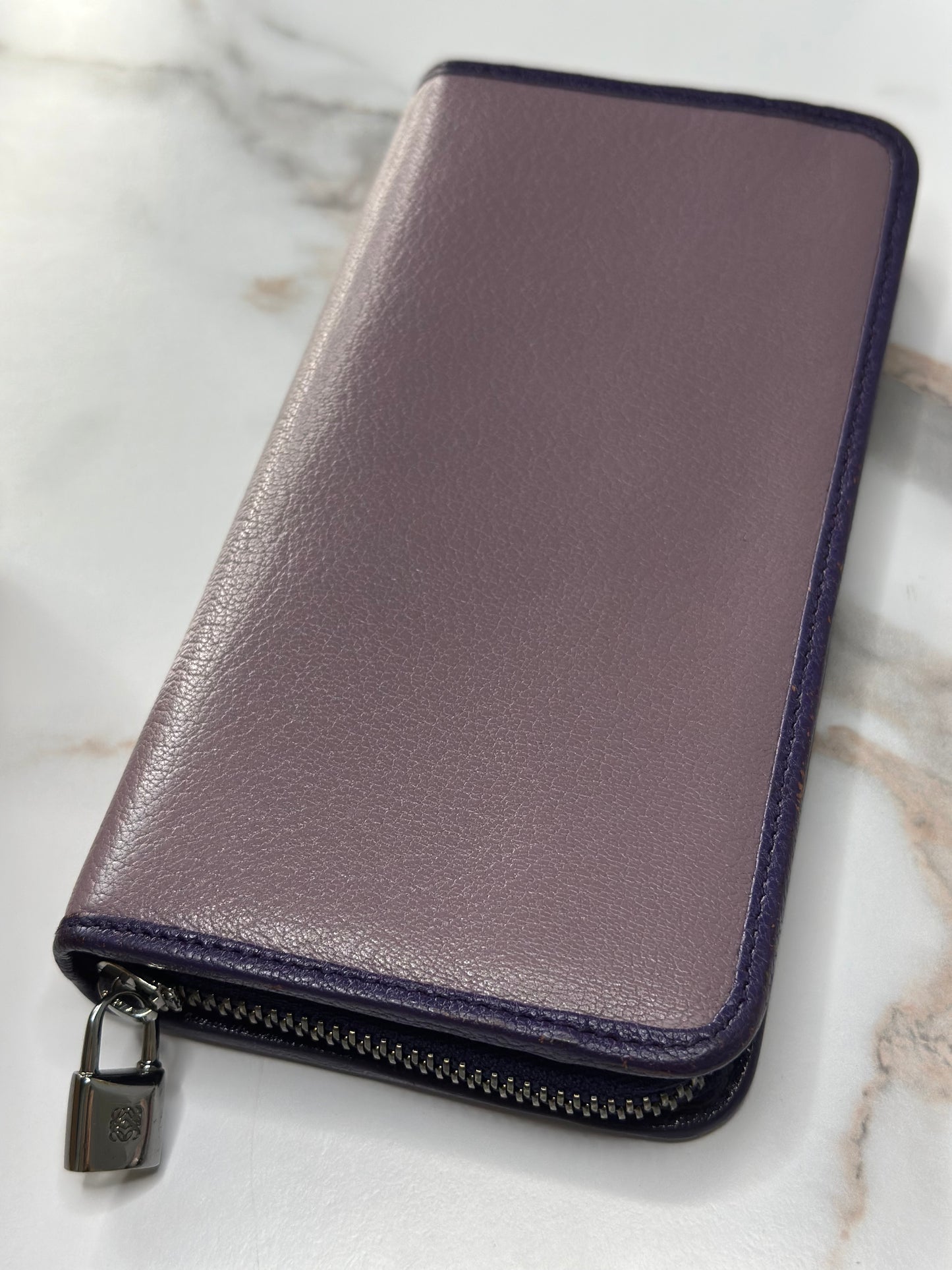 Pre-owned Loewe Anagram continental zip wallet in pebble-grained lilac purple leather