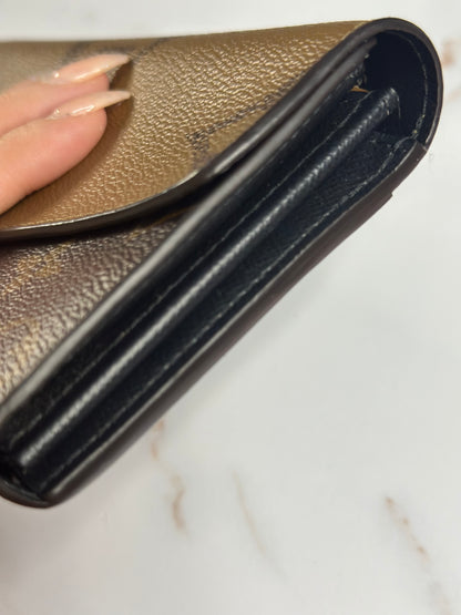 Pre-owned Louis Vuitton reverse monogram Sara wallet